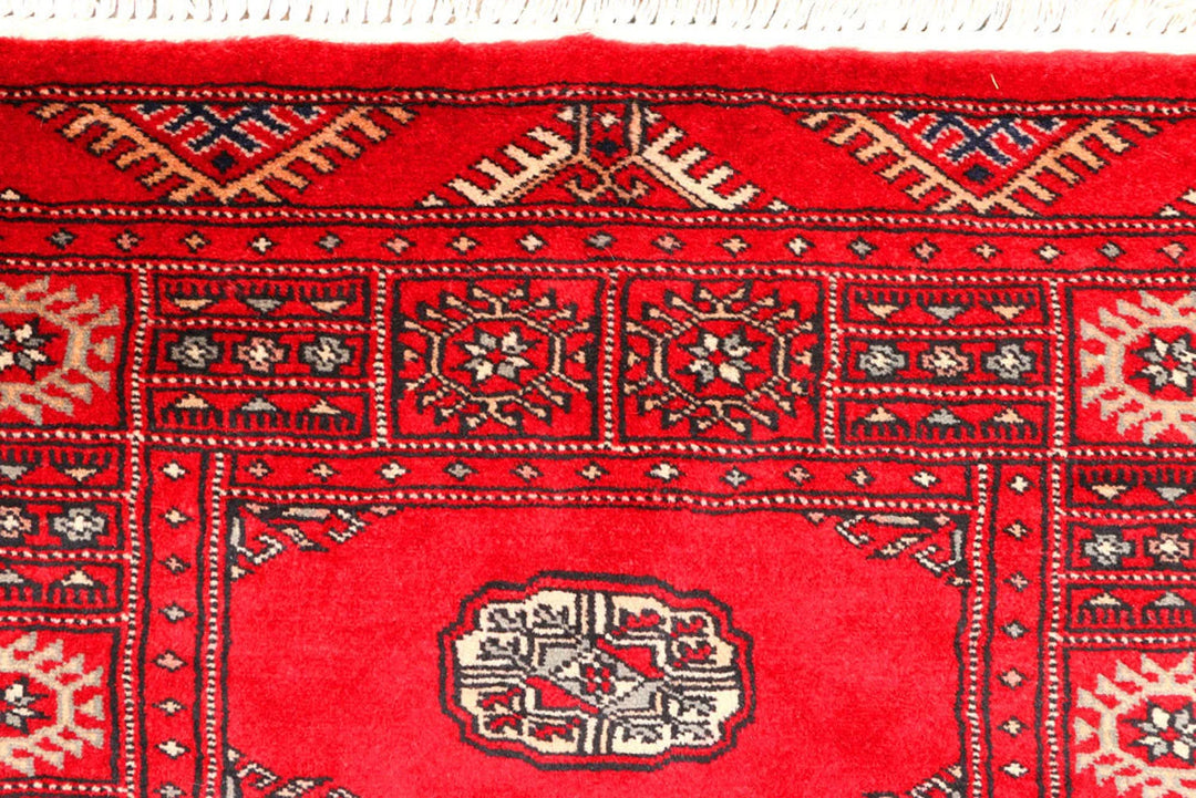 Red Pakistani Bokhara Rug 2' 7" x 9' 4" Hand-Knotted | No. QA78170
