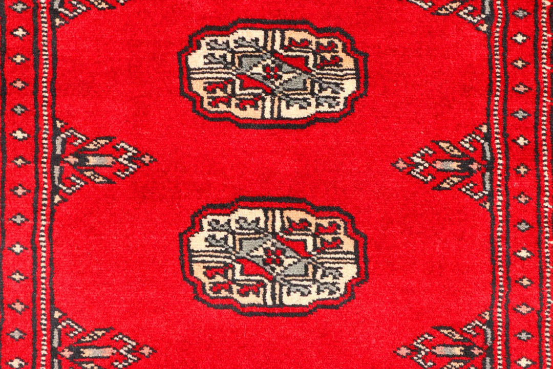 Red Pakistani Bokhara Rug 2' 7" x 9' 4" Hand-Knotted | No. QA78170