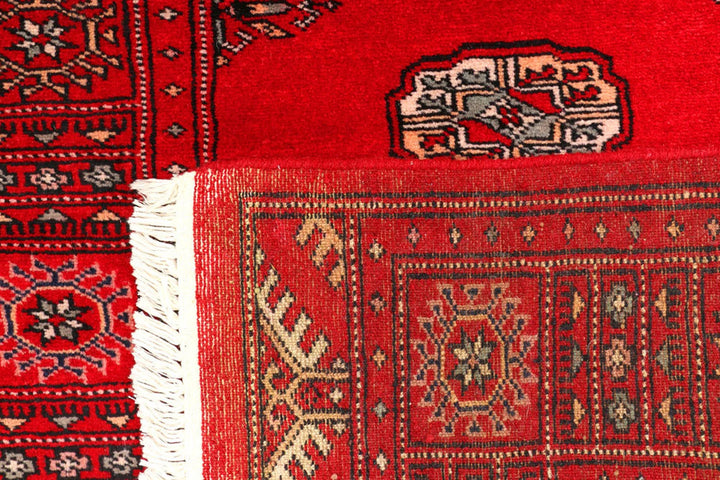 Red Pakistani Bokhara Rug 2' 7" x 9' 4" Hand-Knotted | No. QA78170