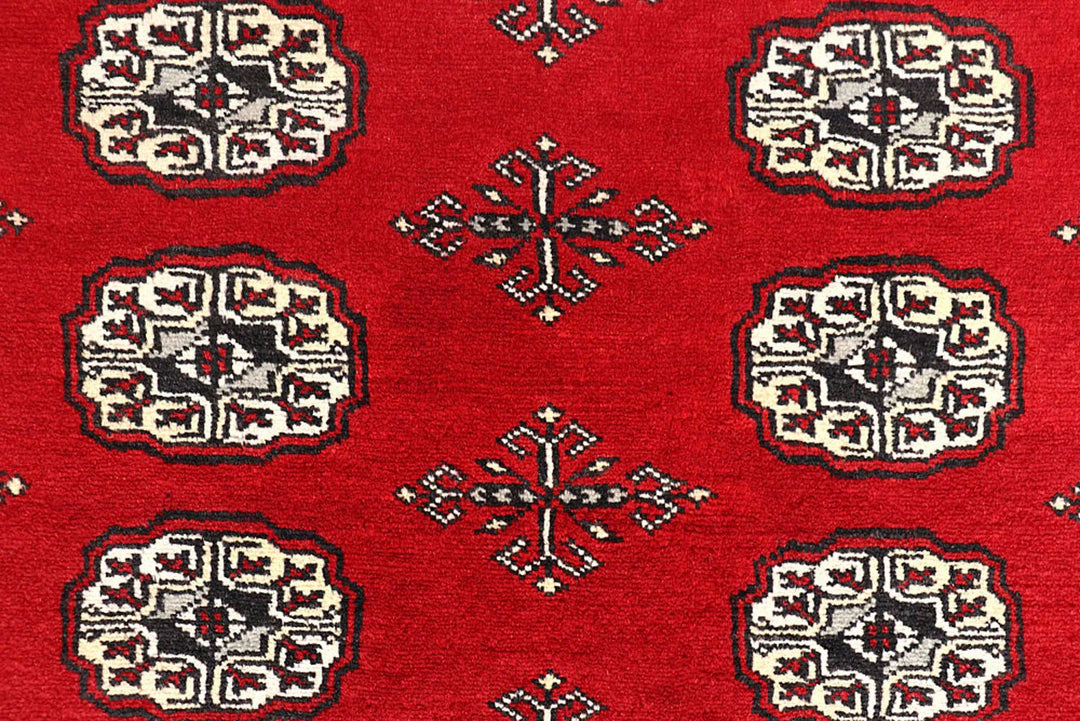 Red Pakistani Bokhara Rug 6' 1" x 9' 6" Hand-Knotted | No. QA78188