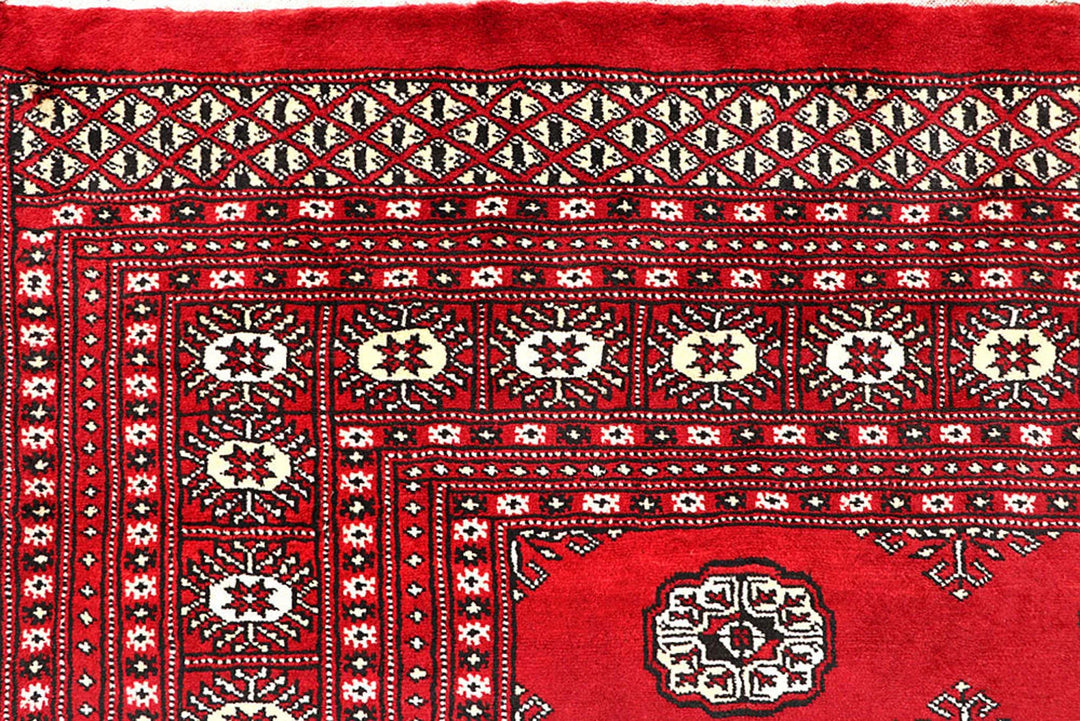 Red Pakistani Bokhara Rug 6' 1" x 8' 10" Hand-Knotted | No. QA79187