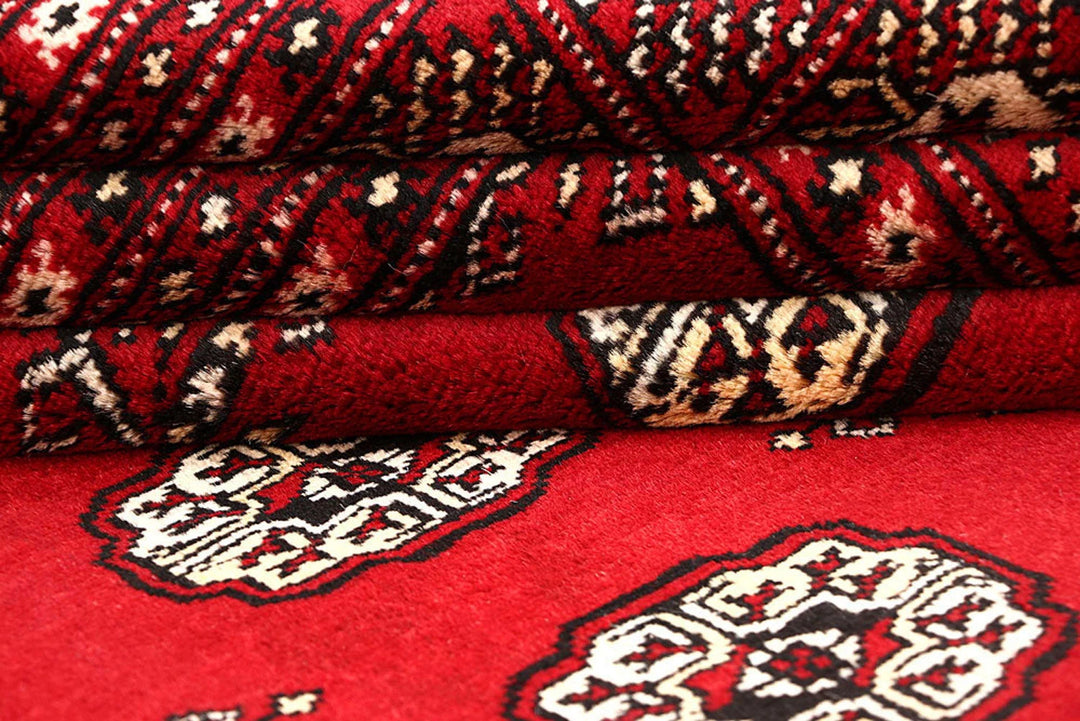 Red Pakistani Bokhara Rug 6' 1" x 8' 10" Hand-Knotted | No. QA79187