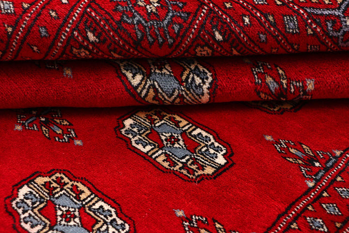 Red Pakistani Bokhara Rug 4' 1" x 6' 1" Hand-Knotted | No. QA79325
