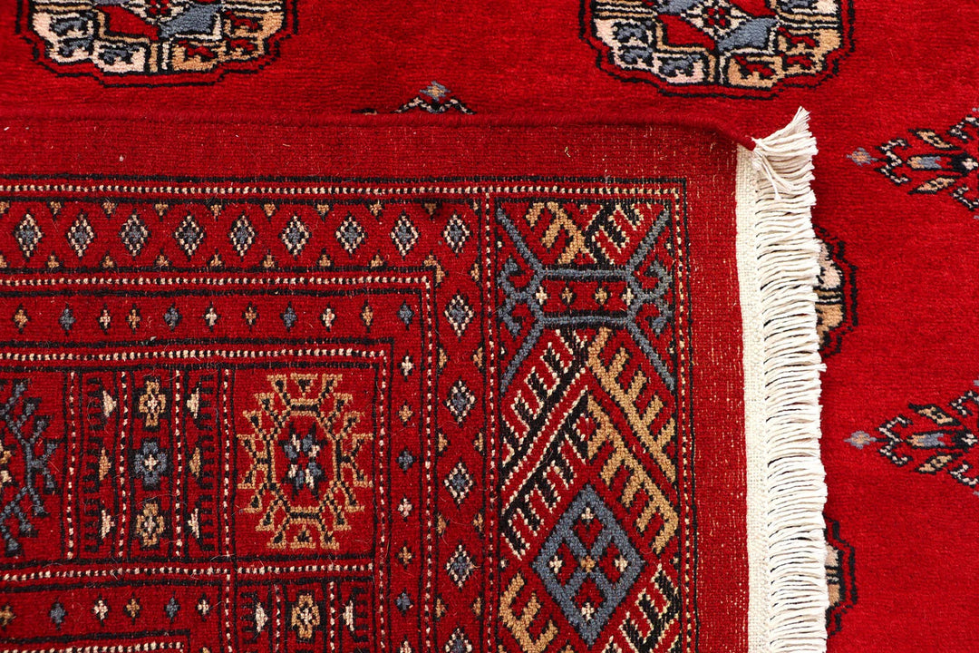 Red Pakistani Bokhara Rug 4' 1" x 6' 1" Hand-Knotted | No. QA79325