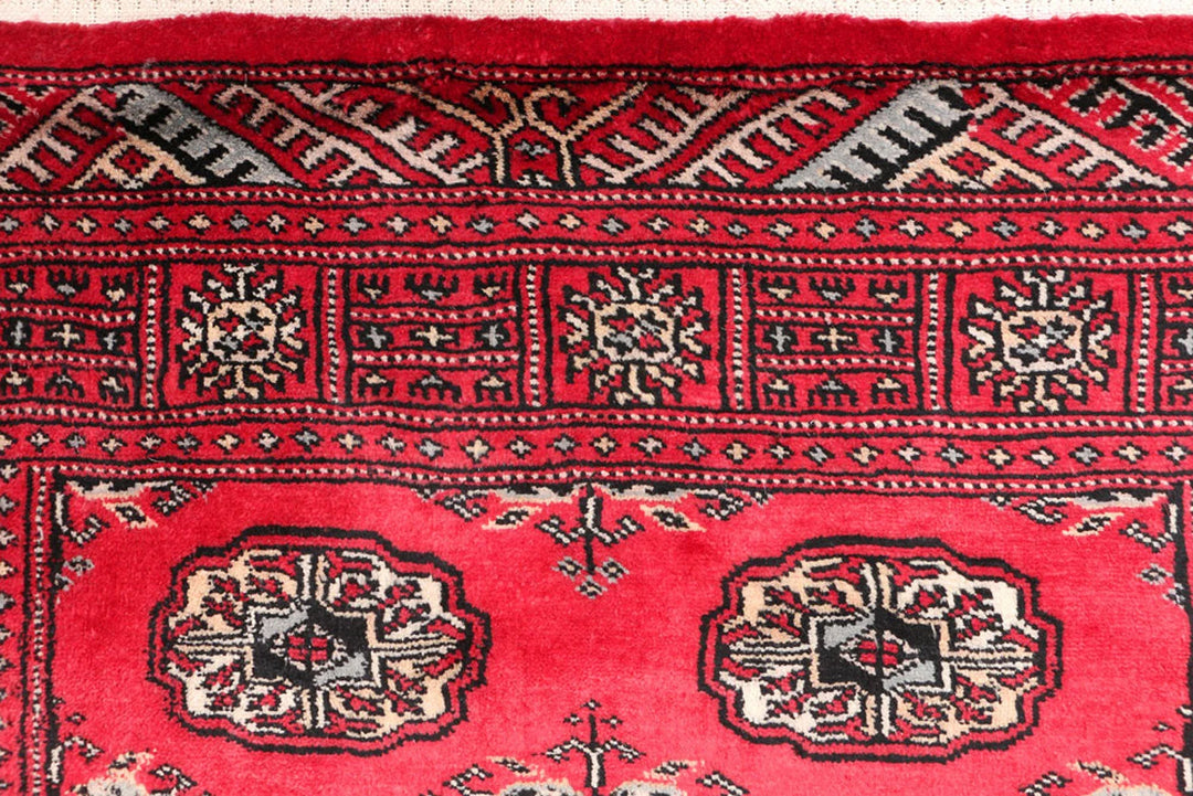 Red Pakistani Bokhara Rug 3' 1" x 5' 3" Hand-Knotted | No. QA82474