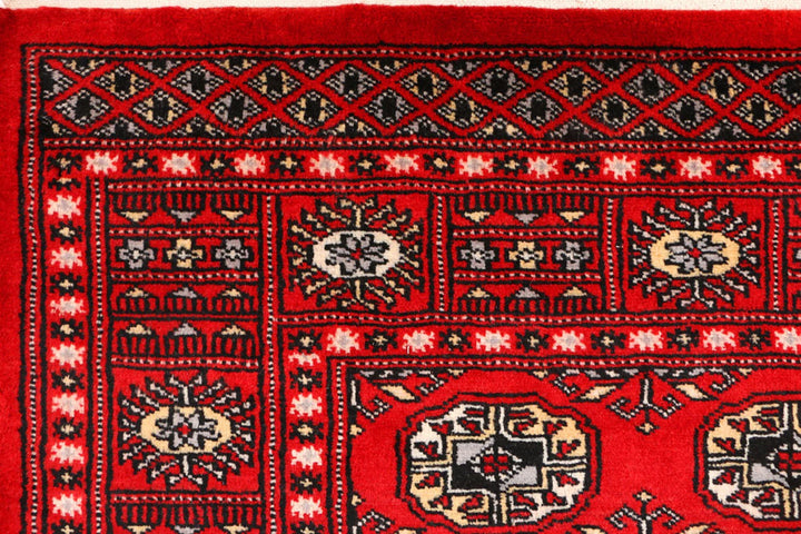 Red Pakistani Bokhara Rug 3' 1" x 5' 4" Hand-Knotted | No. QA82627
