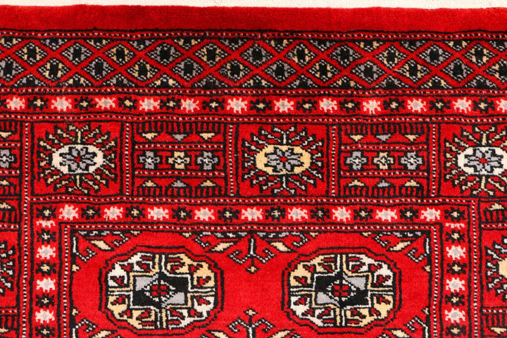 Red Pakistani Bokhara Rug 3' 1" x 5' 4" Hand-Knotted | No. QA82627