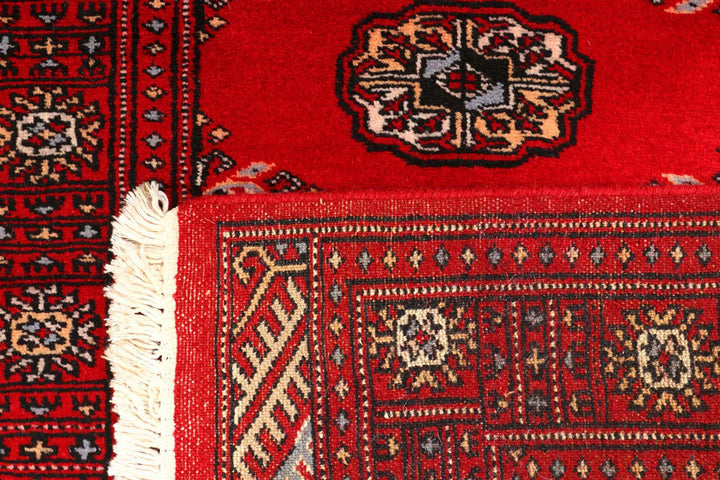 Dark Red Pakistani Bokhara Rug 2' 7" x 8' 9" Hand-Knotted | No. QA83354