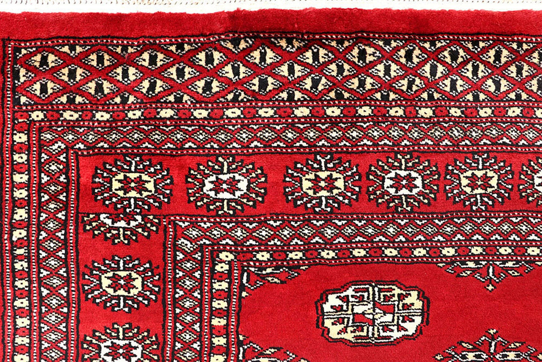 Red Pakistani Bokhara Rug 5' 5" x 8' 6" Hand-Knotted | No. QA84407