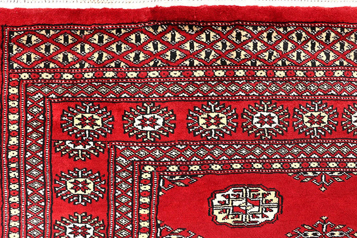 Red Pakistani Bokhara Rug 5' 5" x 8' 6" Hand-Knotted | No. QA84407