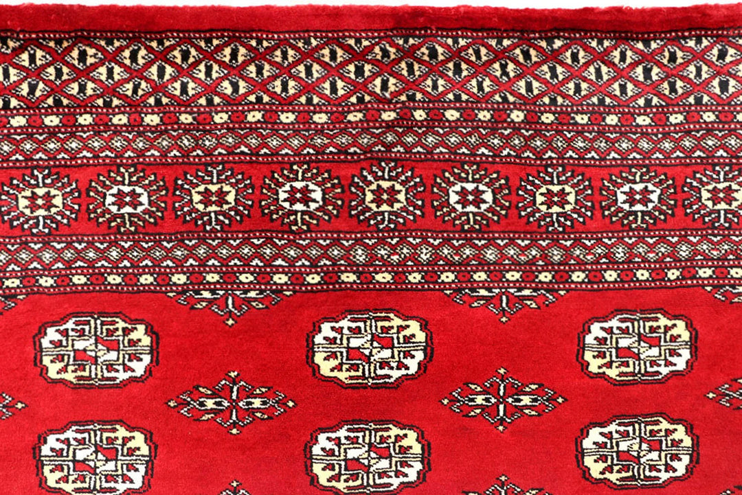 Red Pakistani Bokhara Rug 5' 5" x 8' 6" Hand-Knotted | No. QA84407