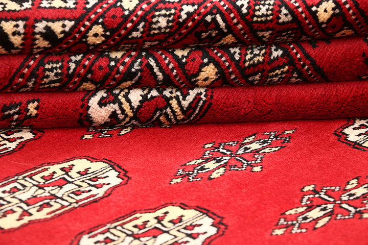 Red Pakistani Bokhara Rug 5' 5" x 8' 6" Hand-Knotted | No. QA84407