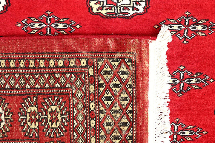 Red Pakistani Bokhara Rug 5' 5" x 8' 6" Hand-Knotted | No. QA84407