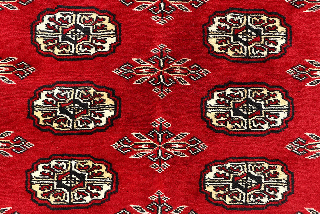 Red Pakistani Bokhara Rug 6' 2" x 8' 5" Hand-Knotted | No. QA84409