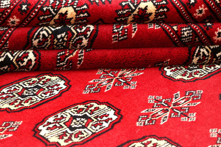 Red Pakistani Bokhara Rug 6' 2" x 8' 5" Hand-Knotted | No. QA84409