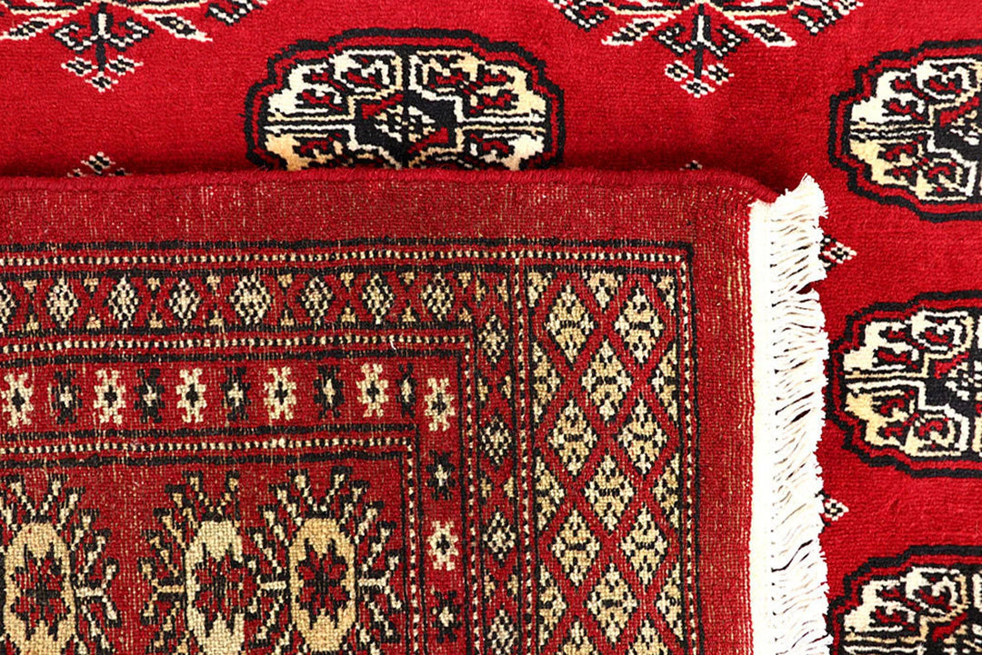 Red Pakistani Bokhara Rug 6' 2" x 8' 5" Hand-Knotted | No. QA84409