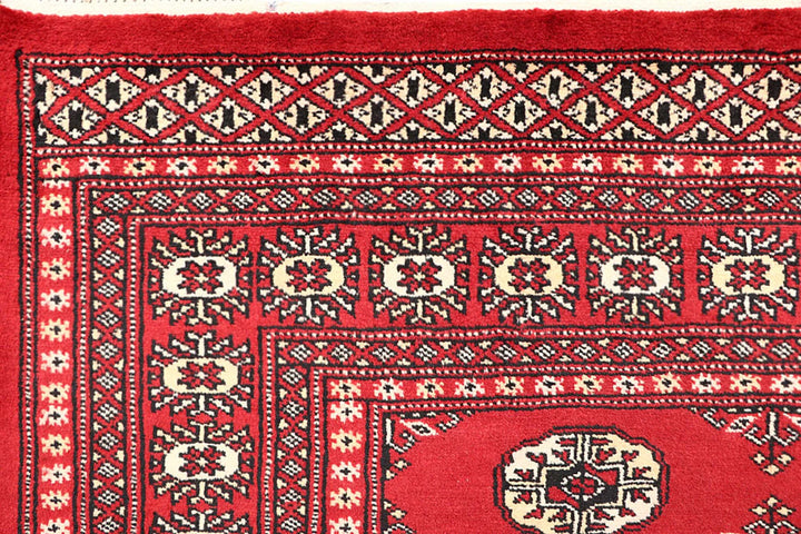 Firebrick Pakistani Bokhara Rug 5' 1" x 8' 2" Hand-Knotted | No. QA84776