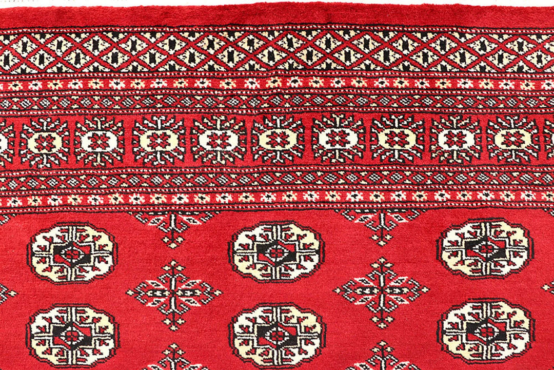 Firebrick Pakistani Bokhara Rug 5' 1" x 8' 2" Hand-Knotted | No. QA84776