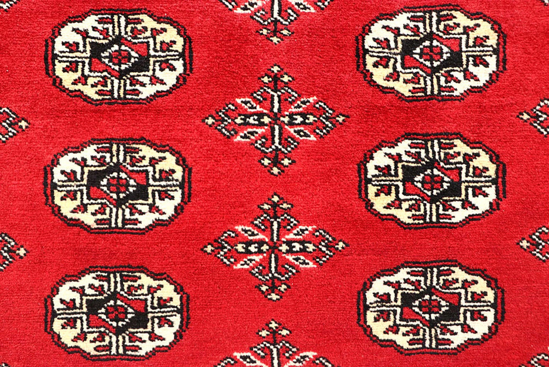 Firebrick Pakistani Bokhara Rug 5' 1" x 8' 2" Hand-Knotted | No. QA84776