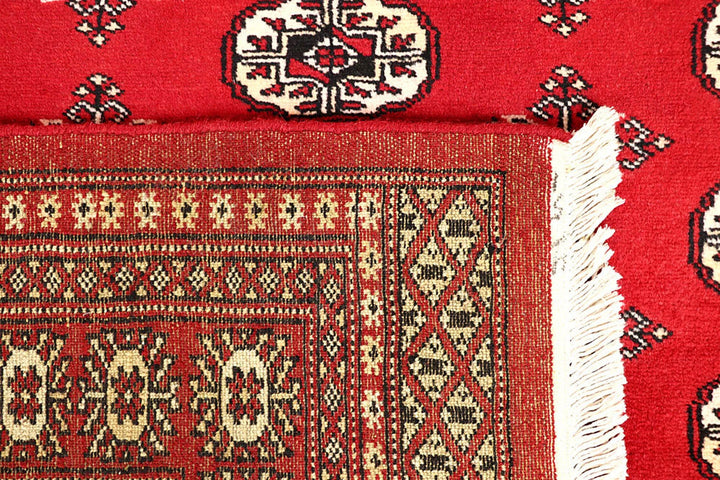 Firebrick Pakistani Bokhara Rug 5' 1" x 8' 2" Hand-Knotted | No. QA84776