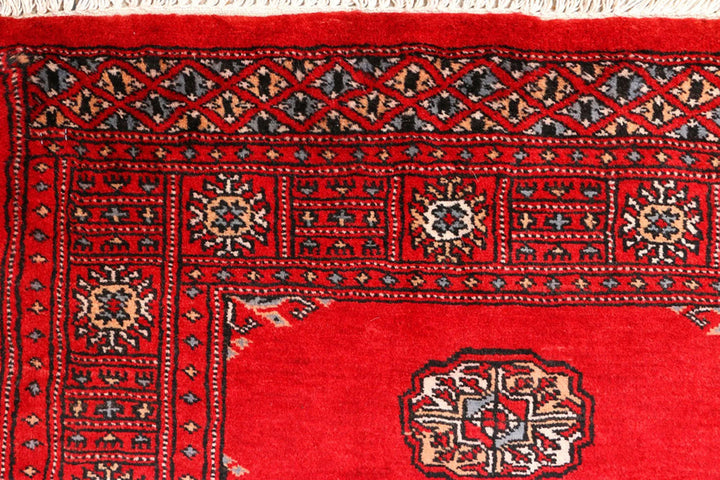 Red Pakistani Bokhara Rug 2' 7" x 8' 10" Hand-Knotted | No. QA85418