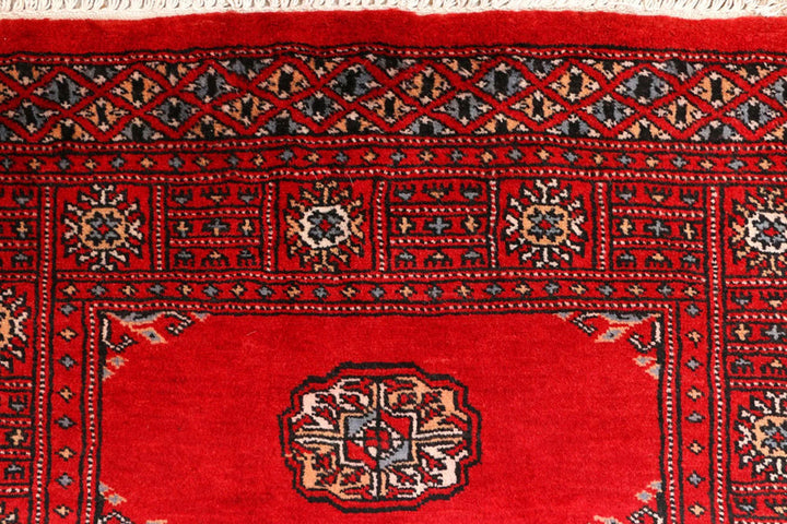 Red Pakistani Bokhara Rug 2' 7" x 8' 10" Hand-Knotted | No. QA85418