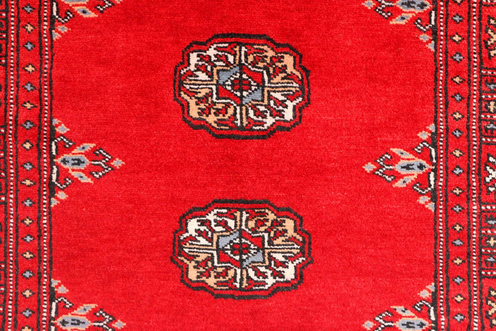 Red Pakistani Bokhara Rug 2' 7" x 8' 10" Hand-Knotted | No. QA85418