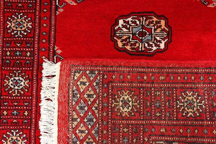 Red Pakistani Bokhara Rug 2' 7" x 8' 10" Hand-Knotted | No. QA85418