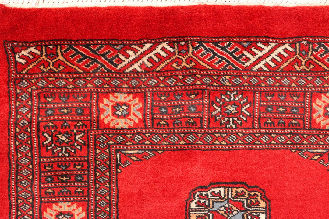 Red Pakistani Bokhara Rug 2' 7" x 11' 3" Hand-Knotted | No. QA86134