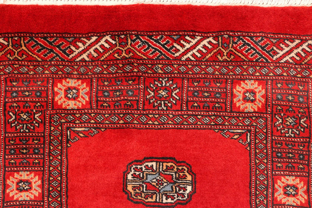 Red Pakistani Bokhara Rug 2' 7" x 11' 3" Hand-Knotted | No. QA86134