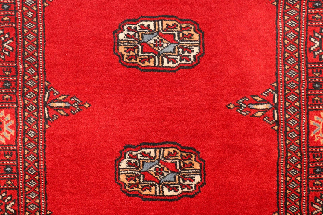 Red Pakistani Bokhara Rug 2' 7" x 11' 3" Hand-Knotted | No. QA86134