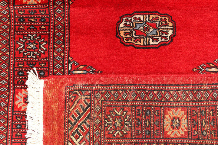 Red Pakistani Bokhara Rug 2' 7" x 11' 3" Hand-Knotted | No. QA86134