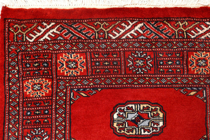 Red Pakistani Bokhara Rug 2' 7" x 10' 1" Hand-Knotted | No. QA86515
