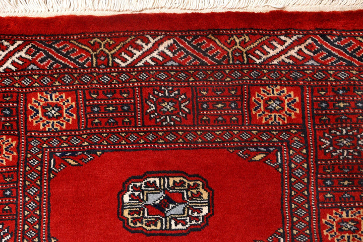 Red Pakistani Bokhara Rug 2' 7" x 10' 1" Hand-Knotted | No. QA86515