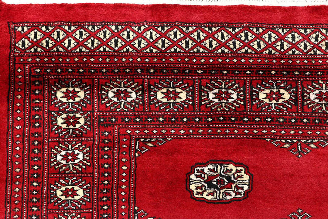 Crimson Pakistani Bokhara Rug 6' 1" x 9' 3" Hand-Knotted | No. QA88043