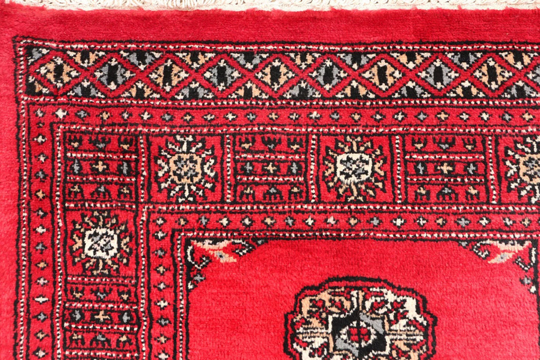 Red Pakistani Bokhara Rug 2' 7" x 11' 6" Hand-Knotted | No. QA88821