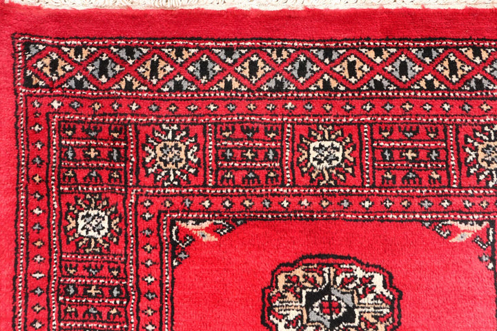 Red Pakistani Bokhara Rug 2' 7" x 11' 6" Hand-Knotted | No. QA88821