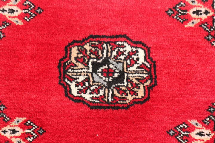 Red Pakistani Bokhara Rug 2' 7" x 11' 6" Hand-Knotted | No. QA88821