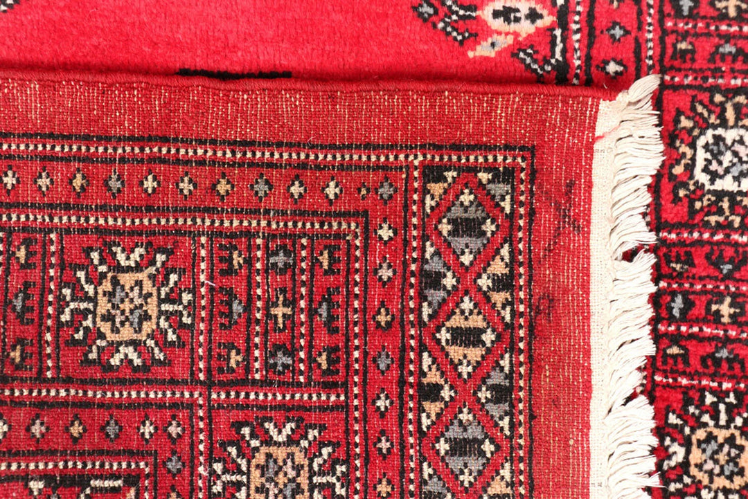 Red Pakistani Bokhara Rug 2' 7" x 11' 6" Hand-Knotted | No. QA88821