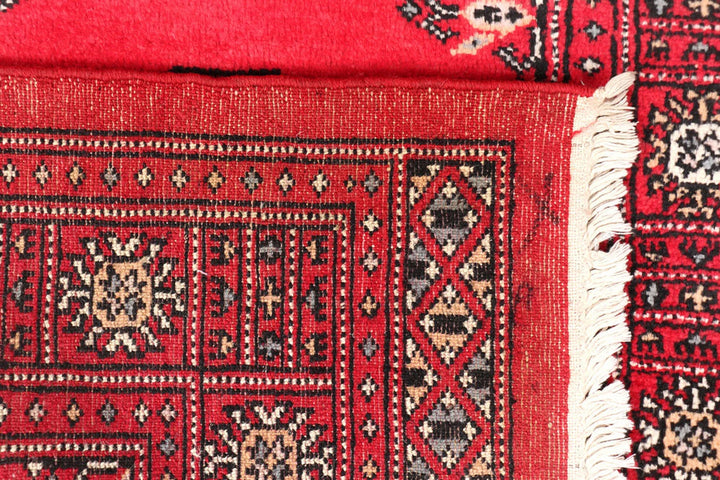 Red Pakistani Bokhara Rug 2' 7" x 11' 6" Hand-Knotted | No. QA88821