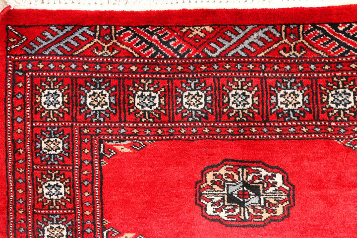 Red Pakistani Bokhara Rug 2' 6" x 9' 3" Hand-Knotted | No. QA90142