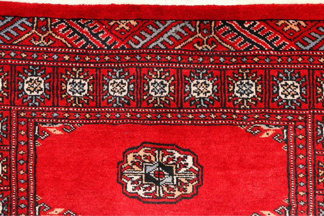 Red Pakistani Bokhara Rug 2' 6" x 9' 3" Hand-Knotted | No. QA90142