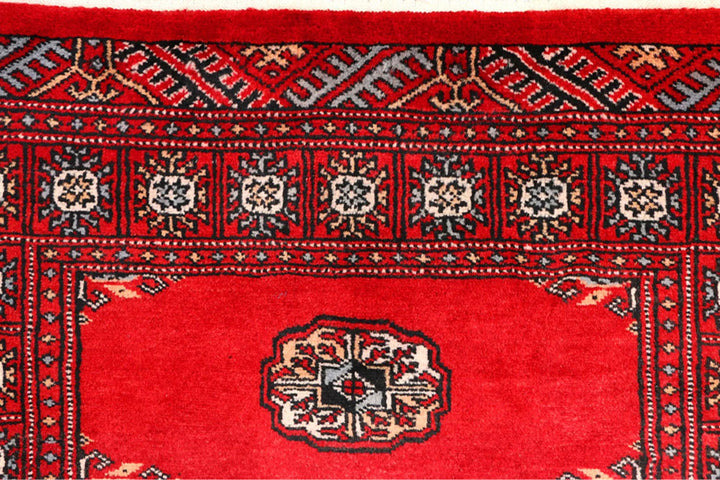 Red Pakistani Bokhara Rug 2' 6" x 9' 3" Hand-Knotted | No. QA90142