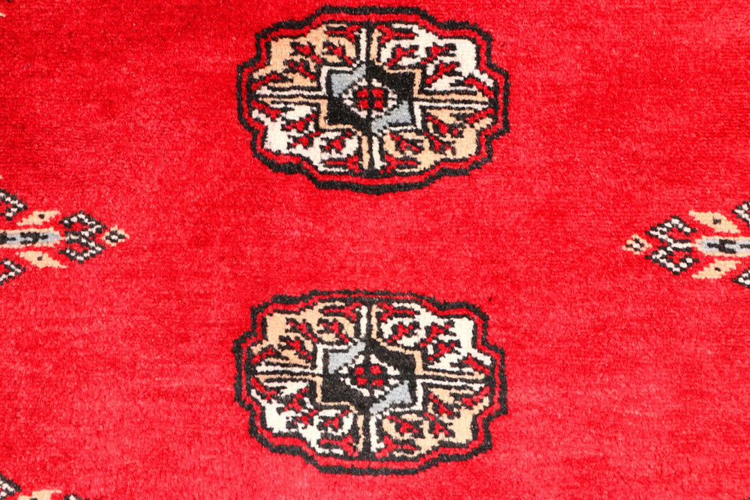Red Pakistani Bokhara Rug 2' 6" x 9' 3" Hand-Knotted | No. QA90142