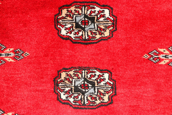 Red Pakistani Bokhara Rug 2' 6" x 9' 3" Hand-Knotted | No. QA90142