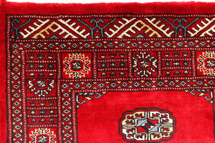 Red Pakistani Bokhara Rug 2' 7" x 9' 5" Hand-Knotted | No. QA92268