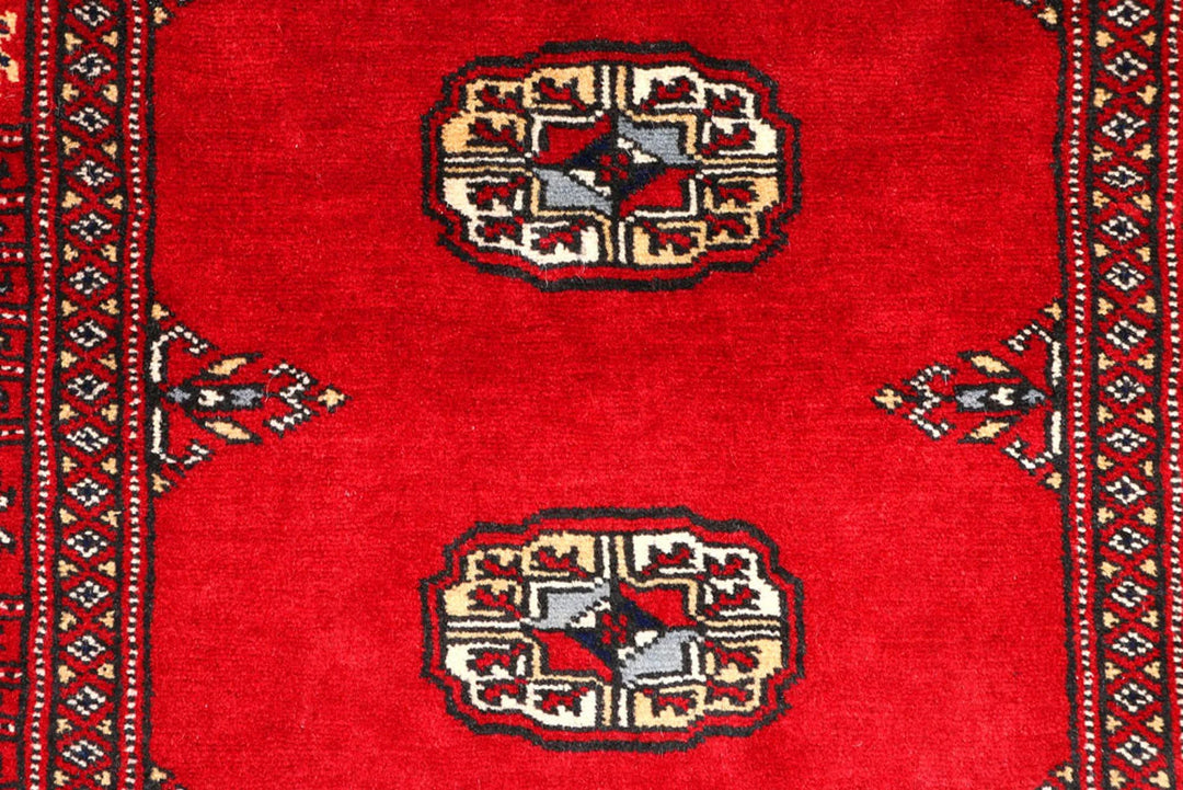 Red Pakistani Bokhara Rug 2' 7" x 9' 5" Hand-Knotted | No. QA92268