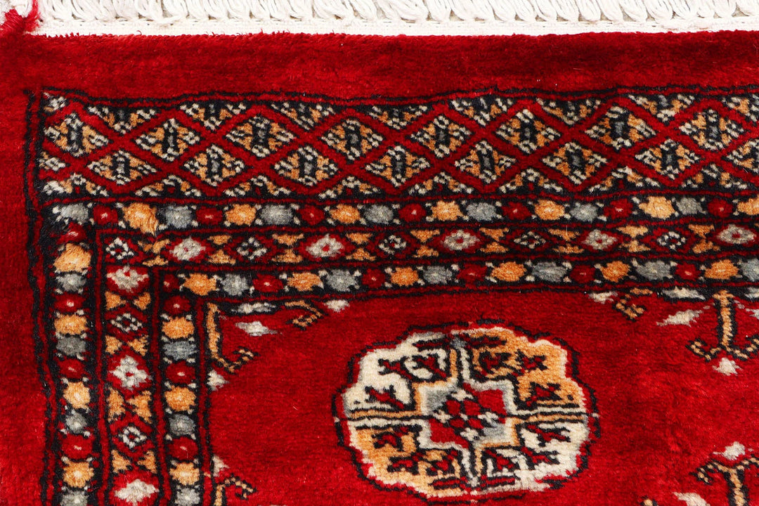 Red Pakistani Bokhara Rug 2' 7" x 9' 9" Hand-Knotted | No. QA92483