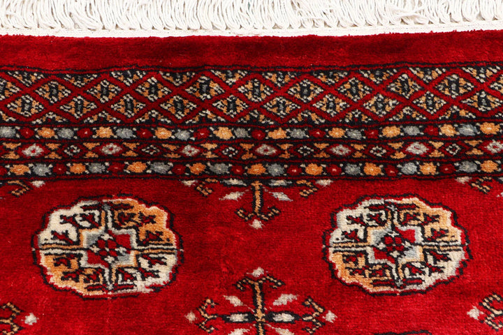 Red Pakistani Bokhara Rug 2' 7" x 9' 9" Hand-Knotted | No. QA92483