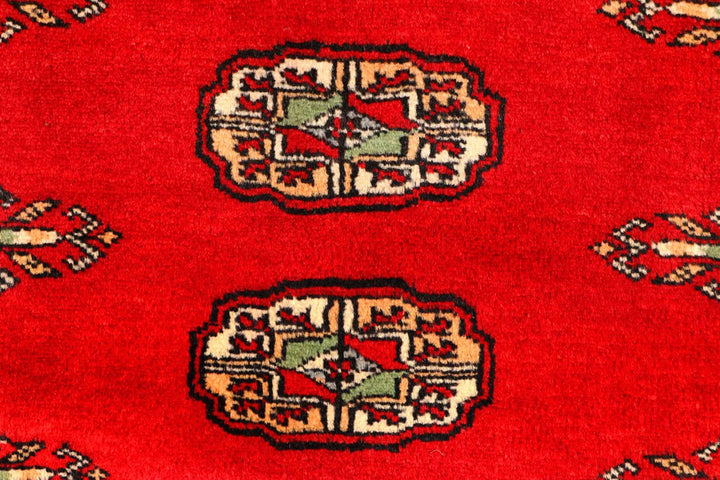 Red Pakistani Bokhara Rug 2' 7" x 9' 5" Hand-Knotted | No. QA93872